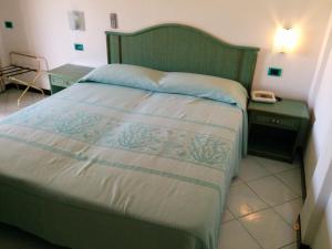 Postel nebo postele na pokoji v ubytování Hotel Blu Marlin