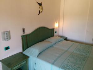Postel nebo postele na pokoji v ubytování Hotel Blu Marlin