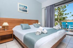 Katil atau katil-katil dalam bilik di Contessa Hotel