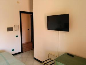 TV a/nebo společenská místnost v ubytování Hotel Blu Marlin
