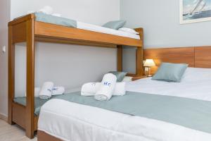 Katil atau katil-katil dalam bilik di Contessa Hotel