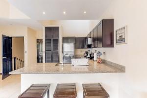 a kitchen with a large counter top in a room at The Cove 10 at Playa Ocotal in Coco