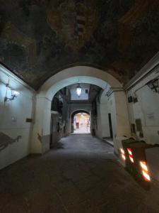 an empty hallway in a building with a ceiling at B&B House S. Ferdinando in Naples