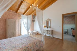 Ένα ή περισσότερα κρεβάτια σε δωμάτιο στο Agriturismo Bressani