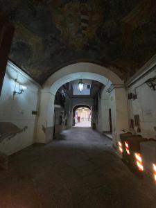 an empty hallway in a building with a ceiling at B&B House S. Ferdinando in Naples