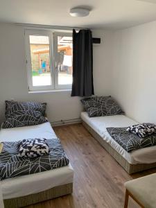 A bed or beds in a room at Sajó Vendégház