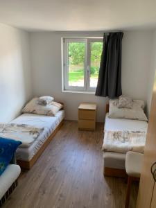 A bed or beds in a room at Sajó Vendégház