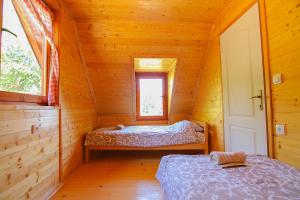 Postel nebo postele na pokoji v ubytování Holiday home Drveni Kutak