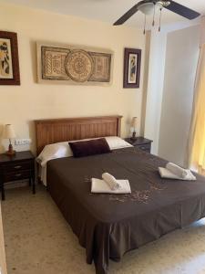 A bed or beds in a room at Casita - El Rincón 23