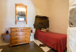 Postel nebo postele na pokoji v ubytování Casa Cueva El Caidero
