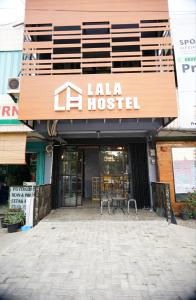 a building with a sign that reads la hostel at Lala Hostel in Banda Aceh