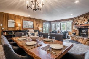 a dining room with a table and a fireplace at Mountainback 15 in Old Mammoth