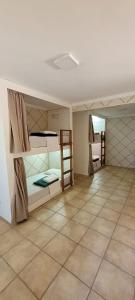 Giường trong phòng chung tại Pousada Reserva do Tombo Lounge Hostel