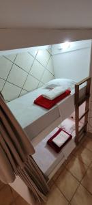 Postel nebo postele na pokoji v ubytování Pousada Reserva do Tombo Lounge Hostel