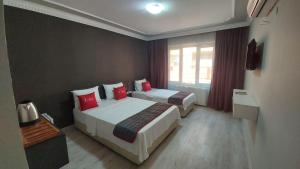 Posteľ alebo postele v izbe v ubytovaní Adalı Hotel & Suites