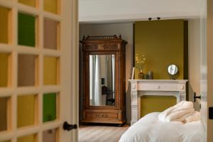Postel nebo postele na pokoji v ubytování B&B Tannerie