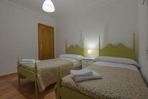 Postel nebo postele na pokoji v ubytování La Comuna Ronda