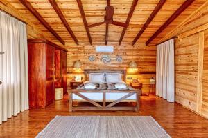 a bedroom with a bed in a wooden room at La Boheme Kabak Adults Only in Faralya