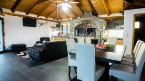 a dining room with a table and chairs at Villa De Luxe in Bihać