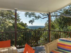 a screened porch with a view of the ocean at Absolute in Point Lookout