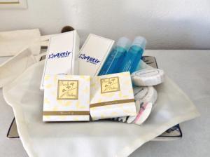 a tray with pens and other items on a table at Astir Of Naxos in Naxos Chora