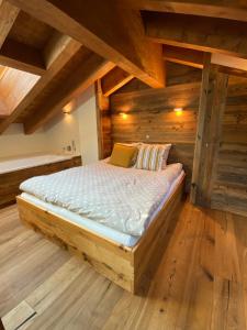 Ένα ή περισσότερα κρεβάτια σε δωμάτιο στο Duplex Spa Access in front of skislope by Jolidi