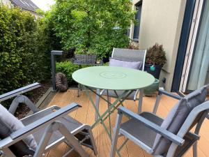 a table and two chairs on a patio at Ferienwohnung Taunus in Görsroth