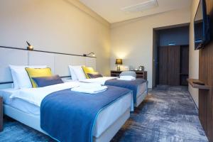 Postel nebo postele na pokoji v ubytování DReAM Boutique Residence