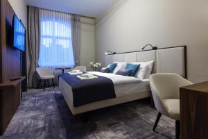 Postel nebo postele na pokoji v ubytování DReAM Boutique Residence
