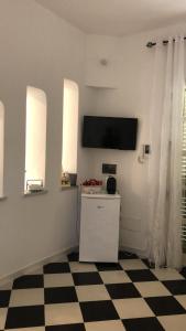 ペトロジーノにあるCase Vacanze Giovannaのテレビ付きの客室