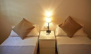 Posteľ alebo postele v izbe v ubytovaní Alguera Apartments Sant Andreu