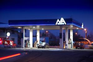 a nissan gas station with cars parked at it at Motel Na Skarpie in Bielsko-Biała