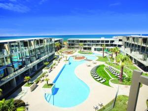 an aerial view of a resort with a swimming pool at Resort Hotel Room 261 in Torquay