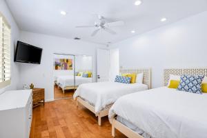 a bedroom with two beds and a flat screen tv at Luxury Estate in Indian Wells Country Club in Indian Wells +34 photos