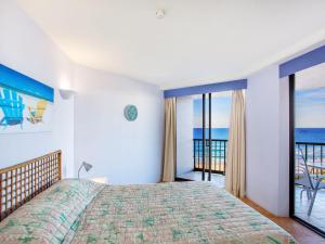 a bedroom with a bed with a view of the ocean at The Rocks Resort Unit 9J in Gold Coast