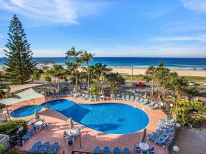 an overhead view of a swimming pool and the beach at The Rocks Resort Unit 3D in Gold Coast