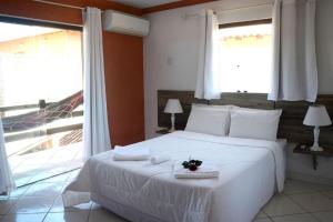 Cama ou camas em um quarto em Pousada Kairos & Spa em Búzios