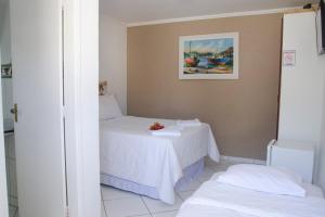 Cama ou camas em um quarto em Pousada Kairos & Spa em Búzios