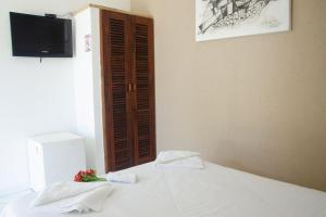 Cama ou camas em um quarto em Pousada Kairos & Spa em Búzios