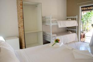 Cama ou camas em um quarto em Pousada Kairos & Spa em Búzios