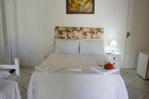 Cama ou camas em um quarto em Pousada Kairos & Spa em Búzios