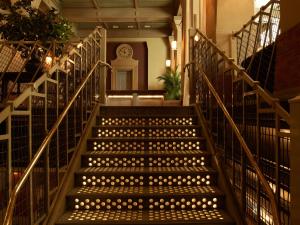a staircase in a building with lights on it at Soho Grand Hotel in New York