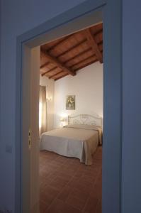 A bed or beds in a room at Agriturismo Piani Della Marina