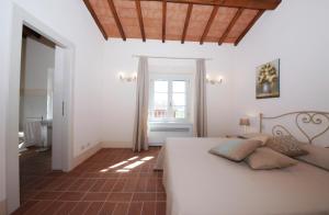 A bed or beds in a room at Agriturismo Piani Della Marina