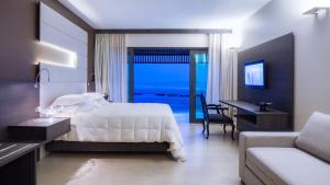 Postel nebo postele na pokoji v ubytování Essenza Hotel