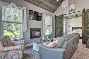 a living room with a couch and a fireplace at Cozy Spring Branch Cottage in Hill Country! in Spring Branch