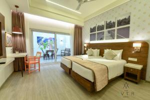 Cama ou camas em um quarto em The Avatar Hotel & Convention