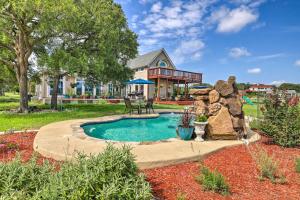a backyard with a swimming pool and a house at Extravagant 4,500 Sq Ft Home in Hill Country! in Spring Branch