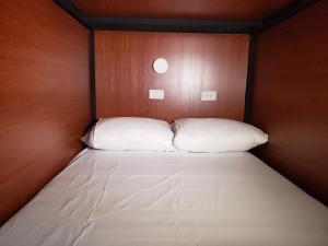 Giường trong phòng chung tại Aima Ibagué