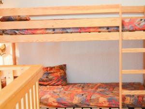 a bedroom with two bunk beds and a staircase at Appartement Valloire, 3 pièces, 6 personnes - FR-1-263-185 in Valloire